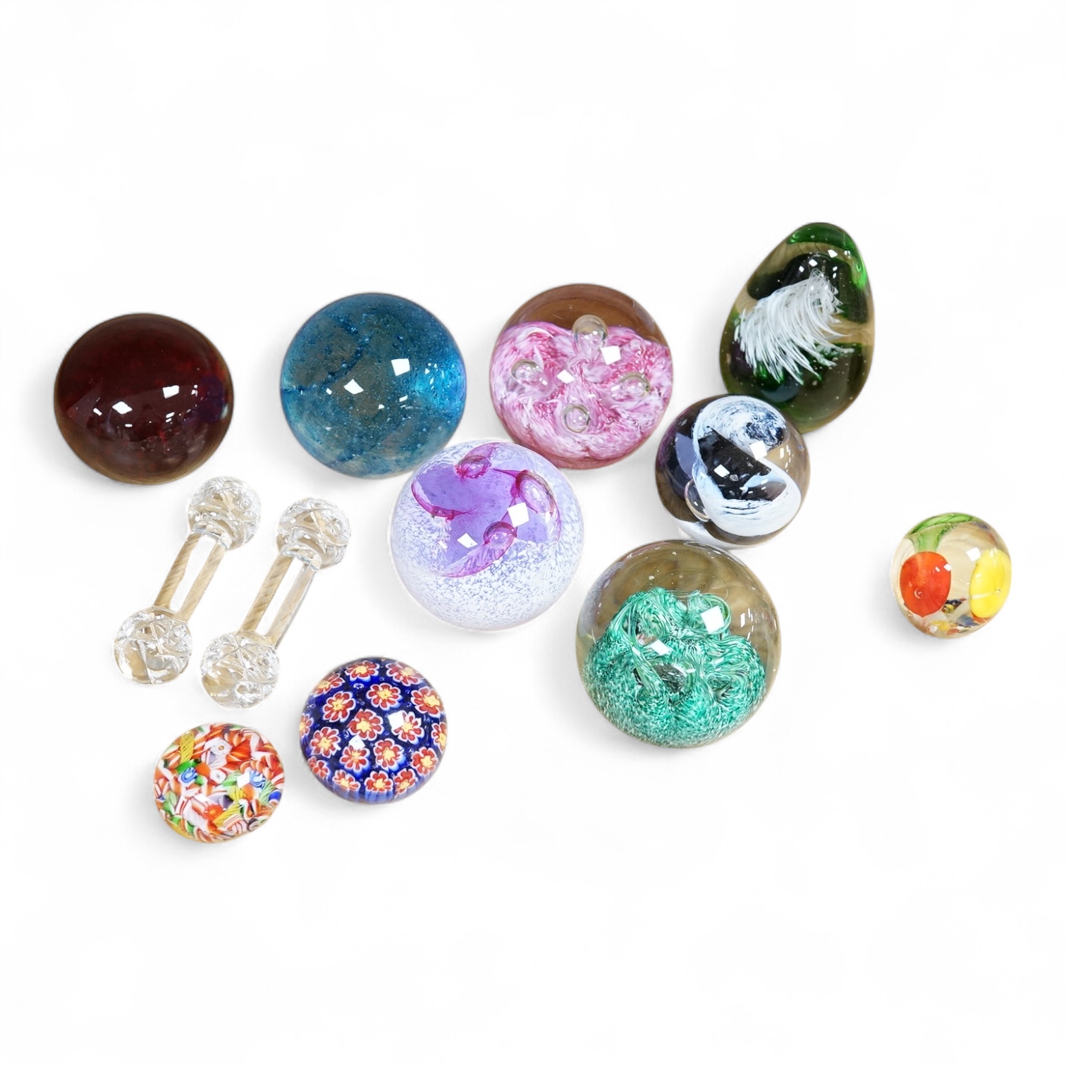 A collection of glass paperweights to include Caithness and millefiori examples, largest 10cm high